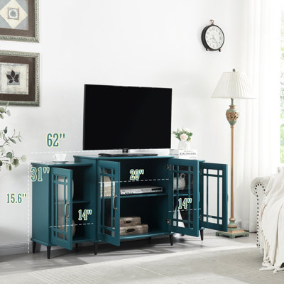 La table de 62 po bleu sarcelle de 62 po, les 8 pieds en métal, les portes en verre trempé et les tablettes réglables ajoutent du style à votre meuble télé en bleu, fabriqué avec et pour la qualité