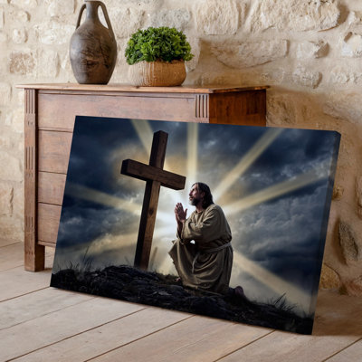 Canvas A Solemn Emotional Scene Depicting A Man In Humble Tattered Wall Art Robes Kneeling In Prayer Beside A Large Wooden Cross His Canvas Wall Art
