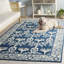 Tapis en laine, coton et viscose touffeté à la main bleu marine et ivoire Oleana-1157848360