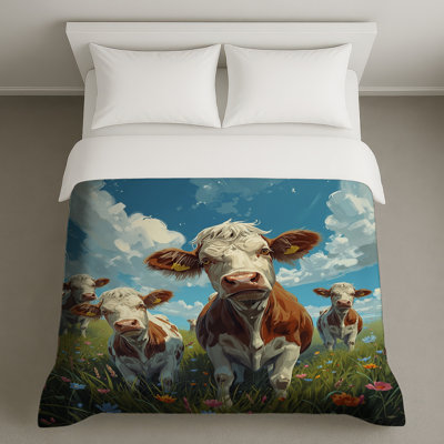 Vaches dans un champ de fleurs Housses de couette