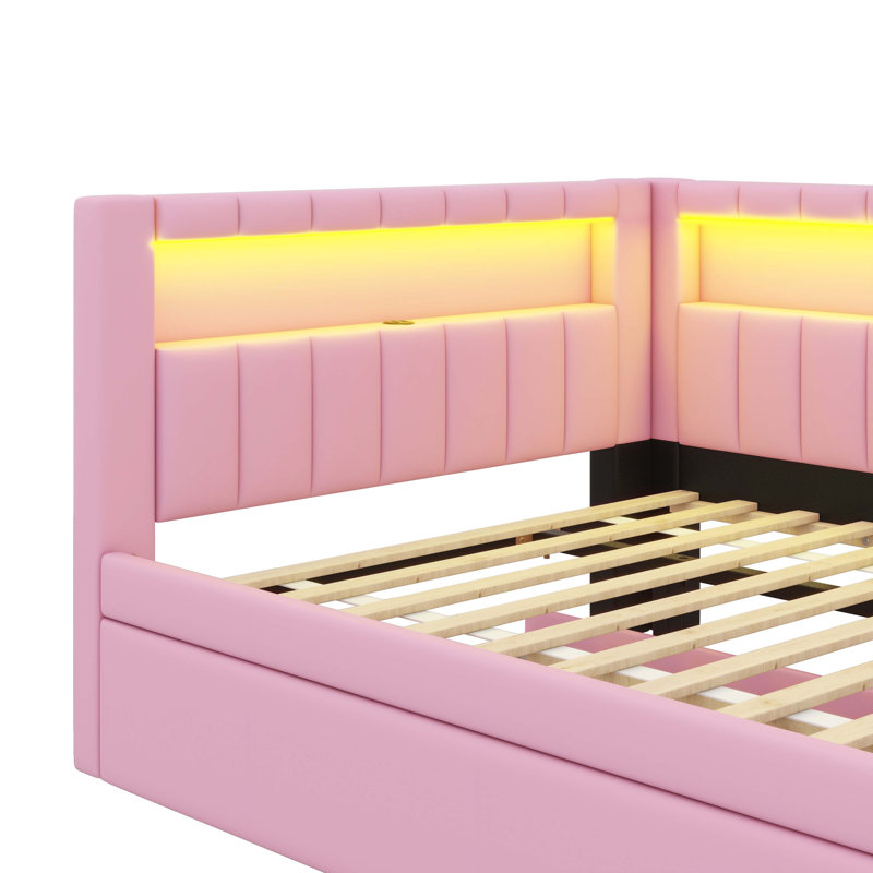 Entirely Upholstered Platform Bed Boasting USB Ports, LED Lighting, And A Trundle, Pink