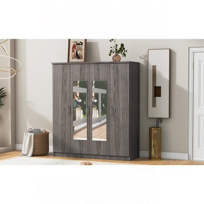 Armoire spacieuse à quatre portes avec miroir intégré et rangement sécuritaire, parfaite pour une chambre organisée