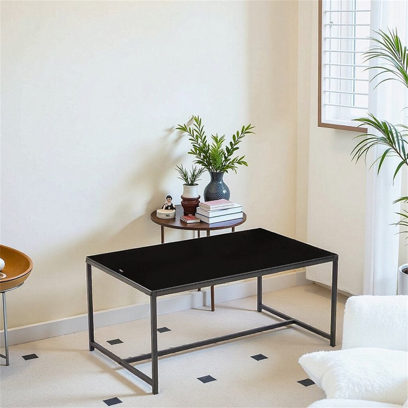 Table basse en verre noir avec pieds en métal