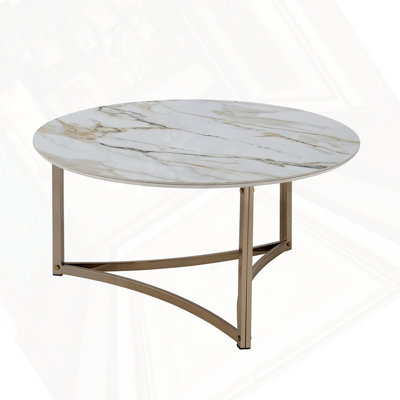 Table basse ronde en fritté avec plateau en pierre et champagne