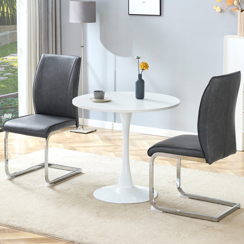  Ensemble de 3 petites tables de salle à manger rondes avec chaises rembourrées en polyuréthane et pieds arqués argentés, gris foncé
