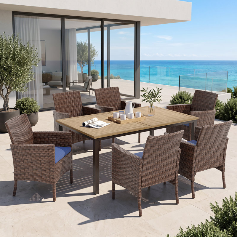 Leonard Rectangular 6 - Person 64" Long Dining Set with Cushions and Umbrella Hole
