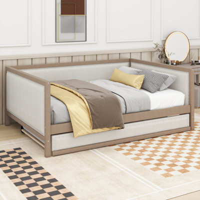 A Full-Sized Upholstered Daybed Complete With A Pull-Out Trundle Bed