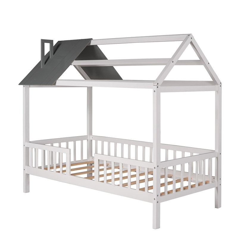 Lit simple en bois avec clôture et gris