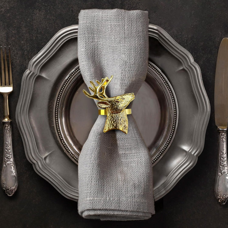 Ensemble de 4 anneaux de serviette dorés avec tête de renne stylisée - Décoration de table de Noël élégante pour la salle à manger