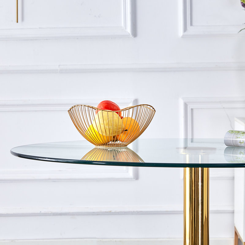 A glass tabletop with a modern minimalist circular dining table, 29.5" H x 35" L x 35" W, Gold