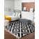Tapis gris à motif géométrique Mitzy
