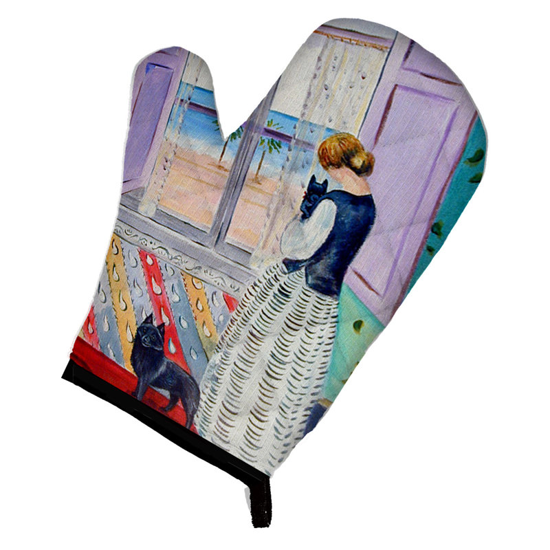 Caroline's Treasures Lady avec son gant de cuisine Schipperke