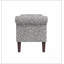 Repose-pieds de rangement Conrad Un choix confortable, de multiples fonctions, un design classique et des coins confortables