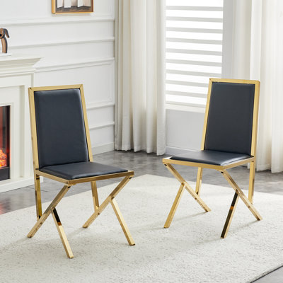 Ensemble de 2 chaises de salle à manger en polyuréthane noir avec cadre en métal doré: design ergonomique, un choix simple et luxueux. Doté de pieds en métal doré de conception unique.