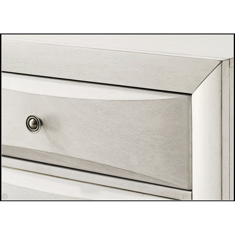 Commode contemporaine blanche neutre à cinq tiroirs avec façades courbées pour un rangement et une organisation élégants