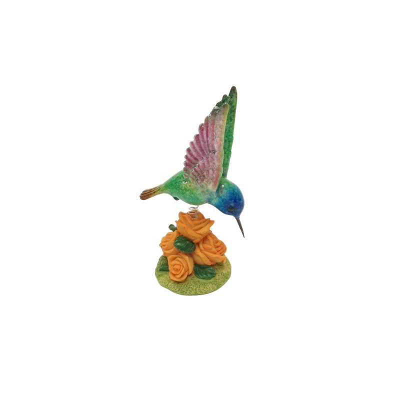 Hummingbird sur les fleurs Delp