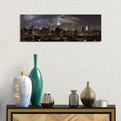 Buildings Lit Up At Night, Empire State Building, Manhattan - Wrapped Canvas Panoramic Print