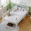 Lits peu encombrants, structure simple en métal blanc avec rangement, chambre à coucher moderne