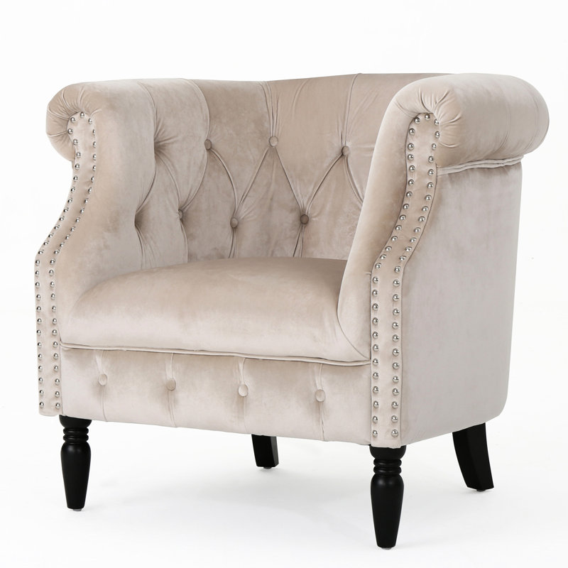 Fauteuil club en velours avec boutons
