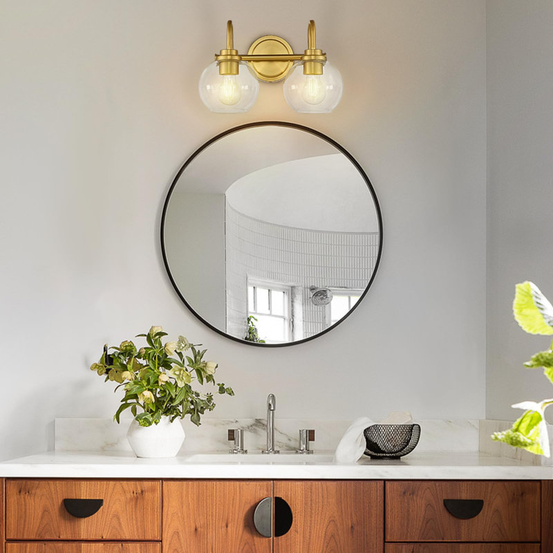 Applique murale pour salle de bain 2 lumières dorées au-dessus d'un miroir avec abat-jour en verre transparent