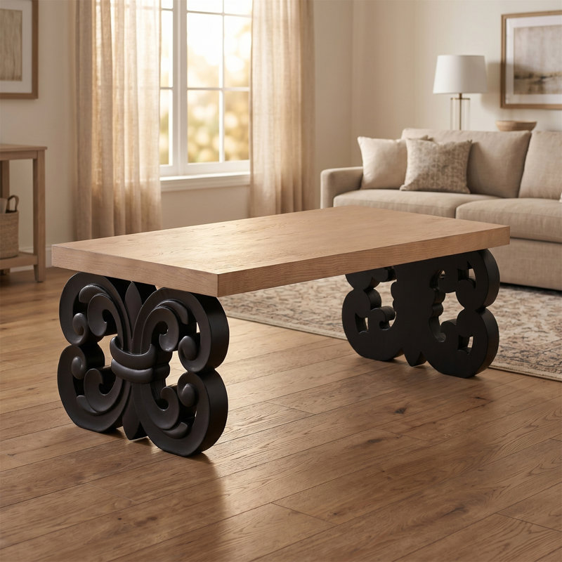 Table basse rectangulaire, base à volutes noire, petite table solide avec double piédestal, design rétro sculpté, plateau de table spacieux, style maison de campagne moderne.