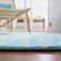 Tapis ivoire / turquoise en laine touffeté à la main à motif géométrique