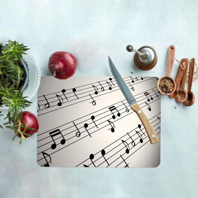 Planche à découper à thème musical avec un musicien et des notes de musique sur un matériau en verre durable, idéal pour la cuisine et la préparation des aliments