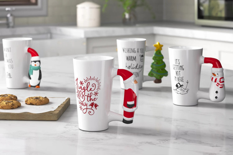modern kitchen with four Christmas-themed mugs