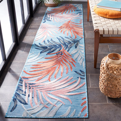 Tapis intérieur / extérieur à motif floral bleu / rouille Afeez