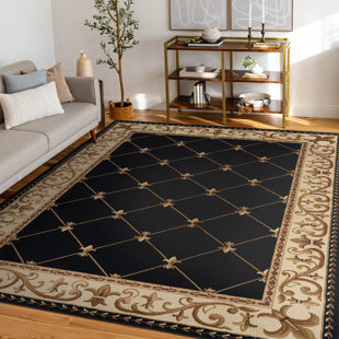 Clarence Oriental Area Rug in Black/Gold