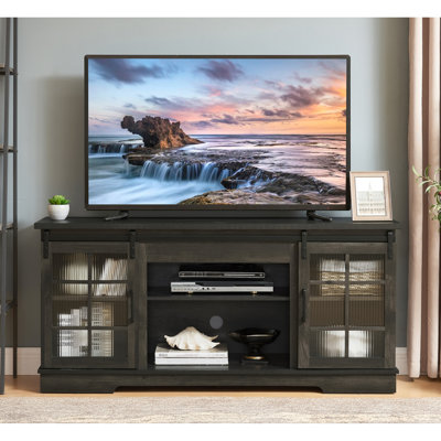 Meuble télé gris anthracite avec portes coulissantes et espace de rangement suffisant pour un support de 65 pouces, portes en verre cannelé.