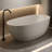 Orange 57 - Inch Freestanding Bathtub In Solid Surface Resin Stone, Slow Heat Loss, Stain Proof, Hand Polished Soaking With Wear , Insulated, Comfortable Waist Fit