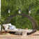 Ekansh Rust Iron 1 - Bulb Seeded Glass Outdoor Wall Lantern with Dusk to Dawn