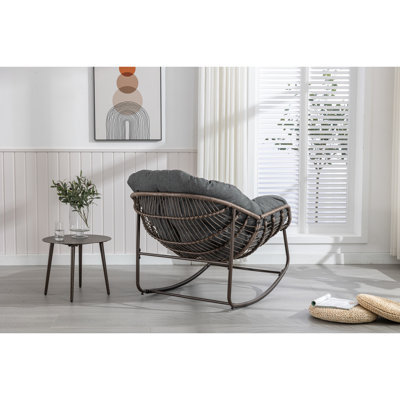 Fauteuil inclinable gris avec chaise berçante