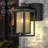 1-Light Black Dusk to Dawn Sensor Outdoor Wall Lantern with Seeded Glass and Built-in GFCI Outlets