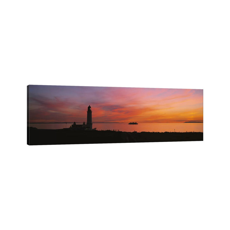Silhouette Of A Lighthouse At Sunset, Scotland by Panoramic Images - Wrapped Canvas Panoramic Print