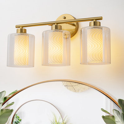 Luminaire de meuble-lavabo moderne en laiton brossé à 3 lumières avec abat-jour en spirale imprimé en 3D et cylindres en verre transparent, luminaire mural à finition dorée pour salle à manger, base E26, homologué UL, largeur 17,32 po