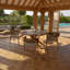 Aderita 4 - Person Acacia Solid Wood Patio Dining Set Round Table with Cushions Included