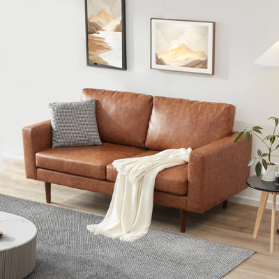 Causeuse à accoudoirs carrés en similicuir 65 po avec coussins réversibles Ashvini