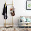 Portant à vêtements 32 po en métal doré avec roues verrouillables et panier de rangement inférieur, idéal pour un usage domestique et commercial dans le couloir, la chambre à coucher, le salon, le balcon, le bureau