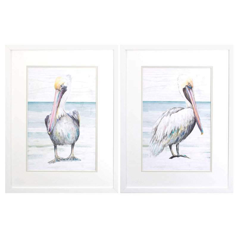 Ensemble de deux pélicans sur le rivage, reproduction d'art encadrée blanche