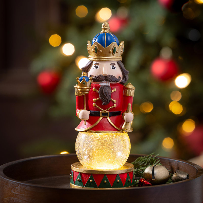 LED Resin Nutcracker with Crackle Glass Globe Table Décor