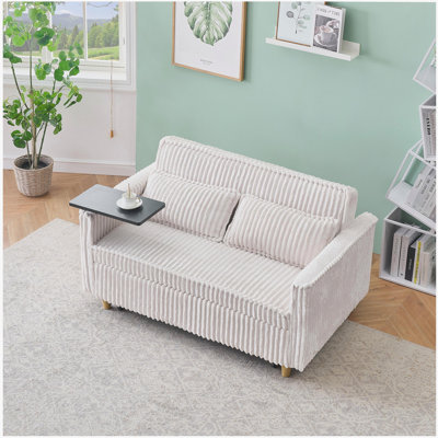 The pull-out and push-in beige corduroy sofa with dual functions, equipped with a movable tabletop and USB ports, is suitable for use in living rooms and bedrooms.