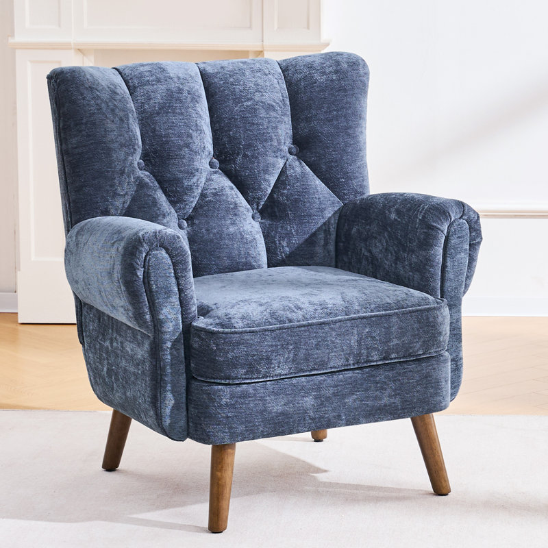 Fauteuil à oreilles capitonné avec accoudoirs roulés et coussins épais., Bleu