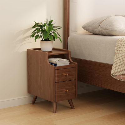 A Small Bedside Table With Drawers