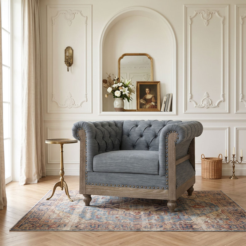 Fauteuil club capitonné