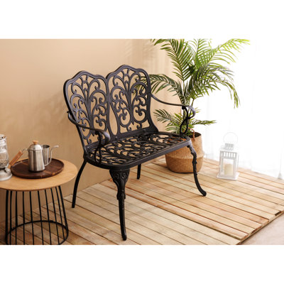 Banc de patio en métal noir avec motif floral rose pour une assise extérieure confortable