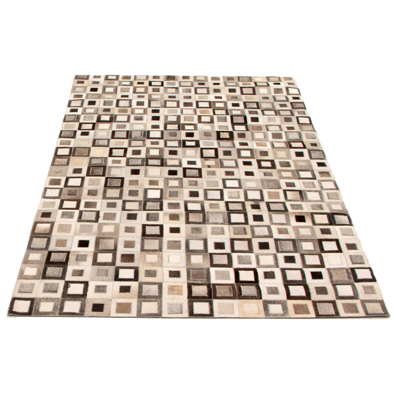 Tapis gris clair / ivoire / noir en cuir de vache fabriqué à la main Arvetta