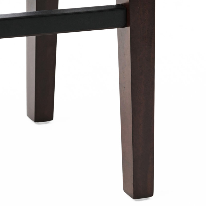 Tabouret brun en cuir brun, soutenu par un bois d'hévéa stable, rehaussé d'une fabrication robuste