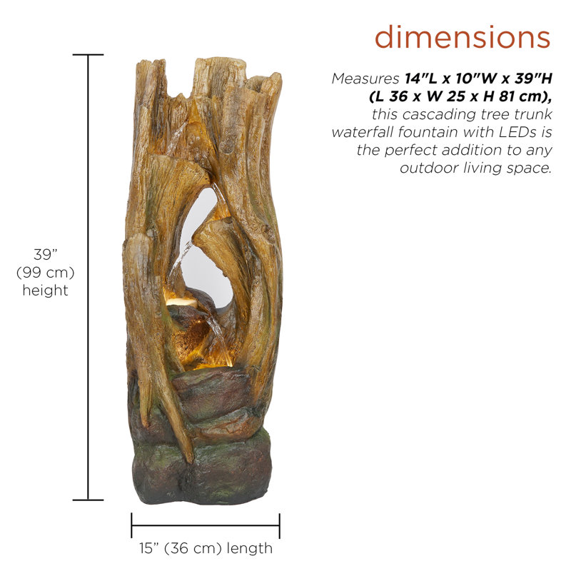 Fontaine en cascade avec troncs d'arbre et lumières DEL
